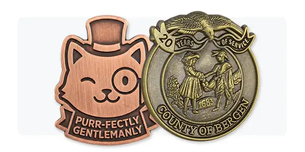 Examples of copper and antiqued gold metal die struck pins. Examples of copper and antiqued gold metal die struck pins.